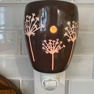 Scentsy brownish flower wall melt warmer.